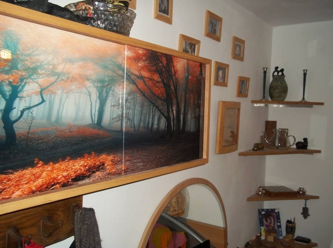 A forest motif transforms the face of a cupboard.
